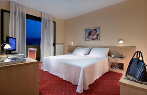 Postel nebo postele na pokoji v ubytování Hotel Terme Marco Polo