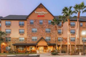 a rendering of the front of a hotel with palm trees at TownePlace Suites by Marriott Yuma in Yuma