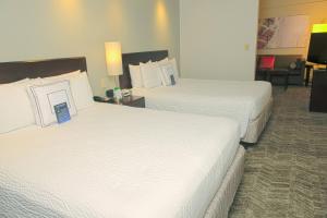 Ένα ή περισσότερα κρεβάτια σε δωμάτιο στο SpringHill Suites Houston Pearland