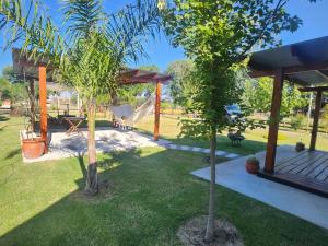 a garden with a playground with a slide at Las Igoa in Carmelo