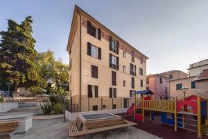a building with a playground in front of a building at Varazze Centro in Varazze