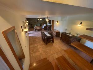 an overhead view of a living room with a table and a kitchen at Quinta do Eirô in Fonte Arcada +14 photos
