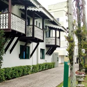 a building with balconies on the side of it at Quinta Da Bica D'Agua Village in Florianópolis