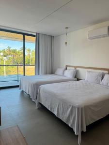 Postel nebo postele na pokoji v ubytování Casa Glass Lux