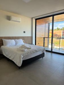 Postel nebo postele na pokoji v ubytování Casa Glass Lux + 27 fotografií