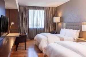 Postel nebo postele na pokoji v ubytování The Westin Guadalajara