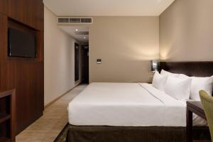 Postel nebo postele na pokoji v ubytování Protea Hotel by Marriott Owerri Select