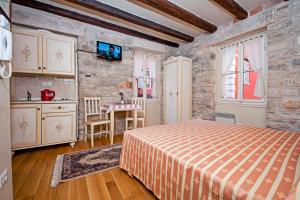 Posteľ alebo postele v izbe v ubytovaní Residence MARCO POLO Centro Storico