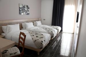 A bed or beds in a room at Hotel A44