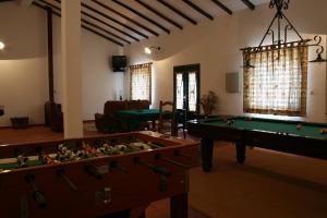 a living room with a pool table and a living room with at Quinta do Belo-Ver Turismo de Habitacao in Belver