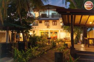 a house with a lot of plants in front of it at Chiller Jone's place in Tangalle
