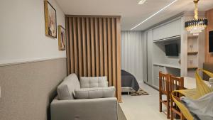 a living room with a couch and a chair at Loft Leben 02 Centro de Pomerode - Loft de luxo in Pomerode