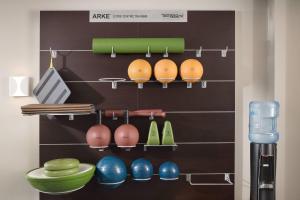 a shelf with bowls and other kitchen utensils at TownePlace Suites by Marriott New Orleans Downtown/Canal Street in New Orleans