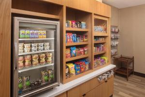 a store with a refrigerator filled with lots of food at TownePlace Suites by Marriott New Orleans Downtown/Canal Street in New Orleans