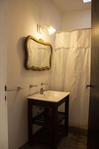 a bathroom with a sink and a mirror and a shower at el maiten in Mar del Plata +32 photos