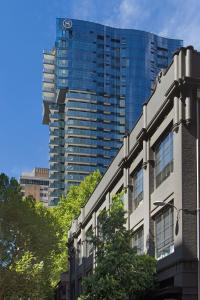 a tall building with a clock on top of it at Sheraton Melbourne Hotel in Melbourne