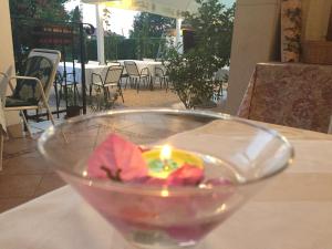 a candle in a glass bowl on a table at Vera Bed and Breakfast in Umag