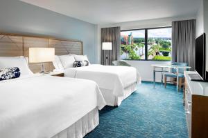 Letto o letti in una camera di Walt Disney World Swan