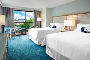 Letto o letti in una camera di Walt Disney World Swan