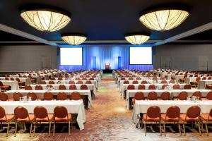 a large room with tables and chairs and chandeliers at The Westin Bonaventure Hotel & Suites, Los Angeles in Los Angeles +83 photos