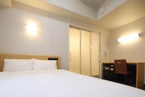 Llit o llits en una habitació de AB Hotel Anjo