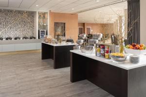 a lobby with two counters with fruit on them at Sheraton Dallas Hotel by the Galleria in Dallas
