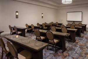 a conference room with tables and chairs and a whiteboard at Sheraton Dallas Hotel by the Galleria in Dallas