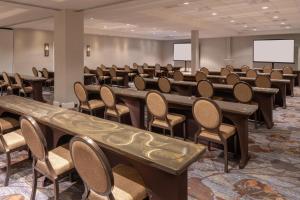 a conference room with rows of tables and chairs at Sheraton Dallas Hotel by the Galleria in Dallas