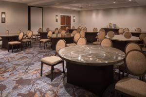 a large room with tables and chairs and tablesktop at Sheraton Dallas Hotel by the Galleria in Dallas