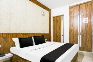 Postel nebo postele na pokoji v ubytování Super Hotel O Sector 52 Gurgaon + 25 fotografií