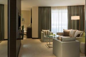 a living room with a couch and a table at Le Royal Meridien Beach Resort & Spa Dubai in Dubai