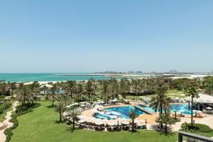 an aerial view of a resort with a pool and palm trees at Le Royal Meridien Beach Resort & Spa Dubai in Dubai