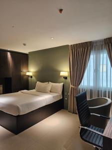 Postel nebo postele na pokoji v ubytování Valentino's Hotel