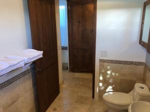 a bathroom with a toilet and a sink at Casa Bella Baja - a wonderful place to relax! in Todos Santos +51 photos