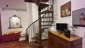 TV a/nebo společenská místnost v ubytování CASA DEL CORSO