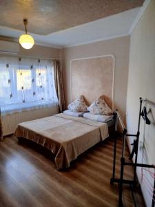 a bedroom with a large bed in a room at Sima in Berehove