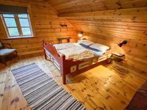Ένα ή περισσότερα κρεβάτια σε δωμάτιο στο 10 person holiday home in KVINESDAL