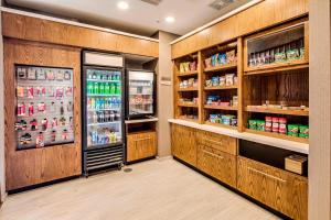 a grocery store aisle with a refrigerator and shelves at SpringHill Suites by Marriott Dayton Vandalia in Murlin Heights