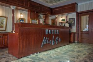 a hotel lobby with a reception desk in a building at Hotel Michele in Sarajevo