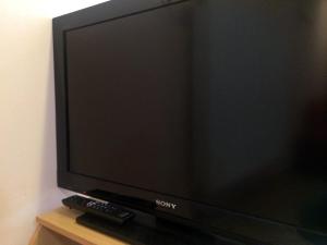En TV eller et underholdningssystem på Apartments Bogdanovic