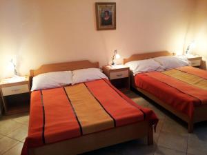 Postel nebo postele na pokoji v ubytování Apartments Bogdanovic