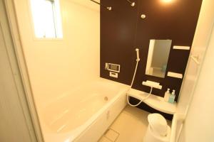 Koupelna v ubytování Casa上熊本2 + 12 fotografií