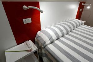 Postel nebo postele na pokoji v ubytování Hotel Aurea