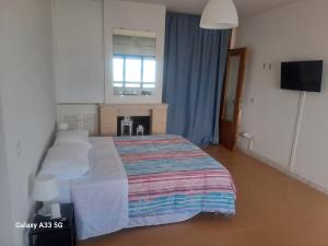Voodi või voodid majutusasutuse La Suite Sinatra toas