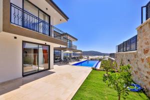 an image of a house with a swimming pool at Villa Maranga in Kalkan