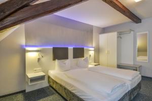 Postel nebo postele na pokoji v ubytování Hotel Wandinger Hof by Lehmann Hotels