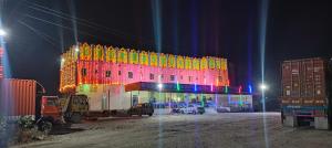 a lit up building with christmas lights on it at Hotel Shree Ram in Kishangarh