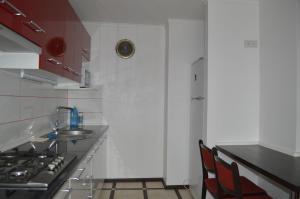 a kitchen with a sink and a stove top oven at Apartment On Pribuzhskaya 2 in Khmelnytskyi