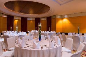 a banquet hall with white tables and white chairs at The Westin Dhaka in Dhaka +53 photos