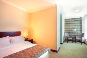 Vuode tai vuoteita majoituspaikassa Hotel Turist